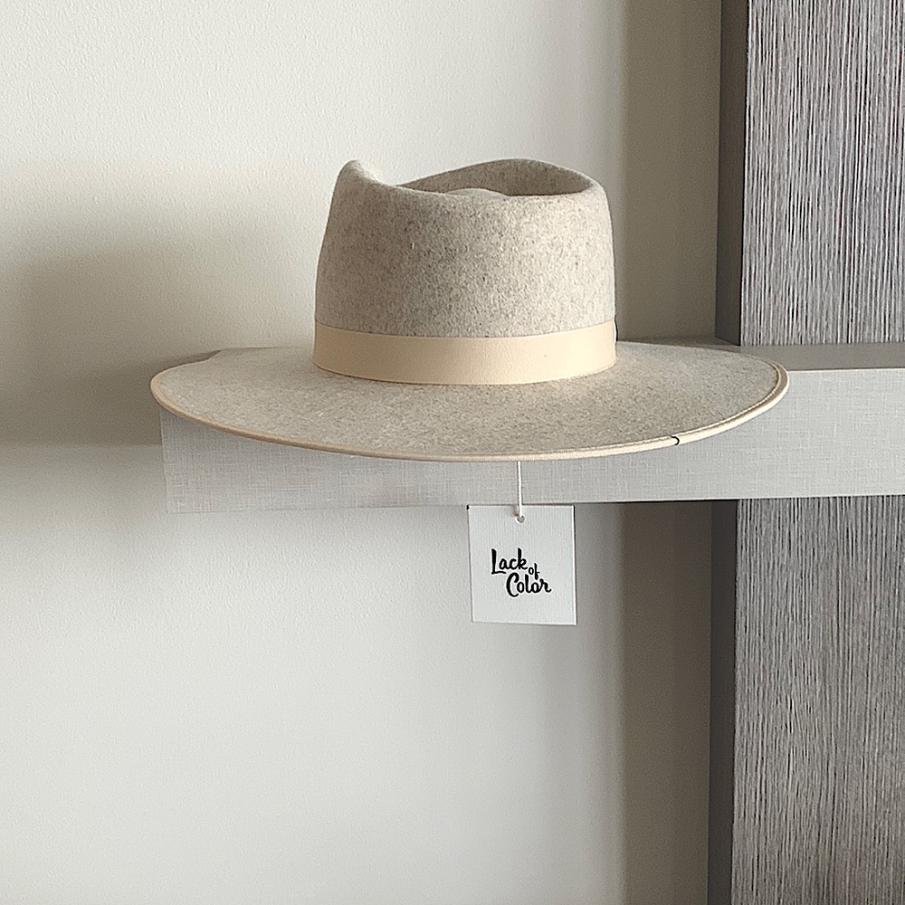 Brand new, tags on Iight grey/ ivory ribbon Lack of Color Rancher Hat. Tags on.